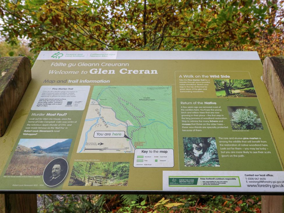 A sign with information about Glen Creran and trails at Elleric Pods - The Last Resort, Appin