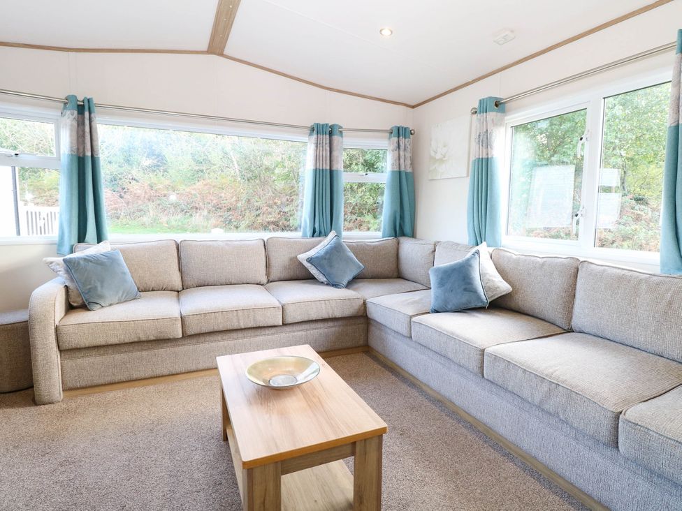 A living room with a sofa and coffee table at Four Seasons Great Yarmouth