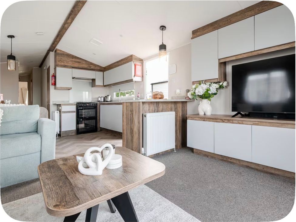 A living room with a sofa and coffee table at Brookwood Willerby, 36 bay view, Filey