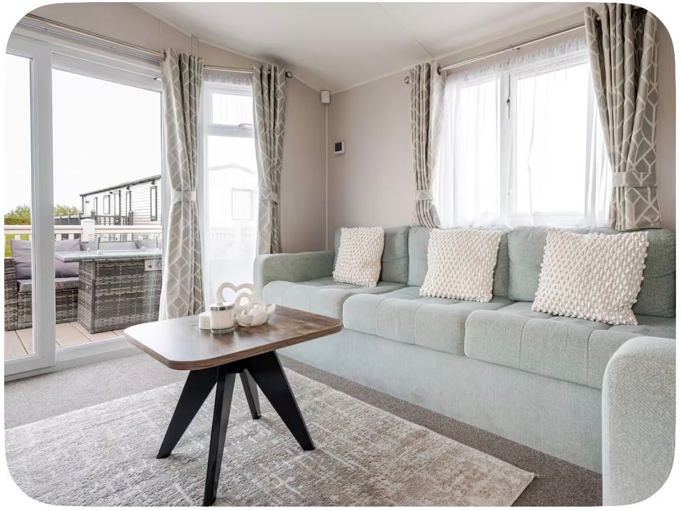 A living room with a sofa and a coffee table at Brookwood Willerby, 36 bay view in Filey