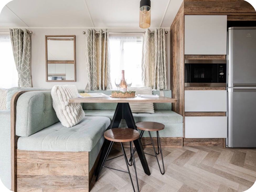 A dining area with a table and chairs at Brookwood Willerby, 36 bay view, Filey