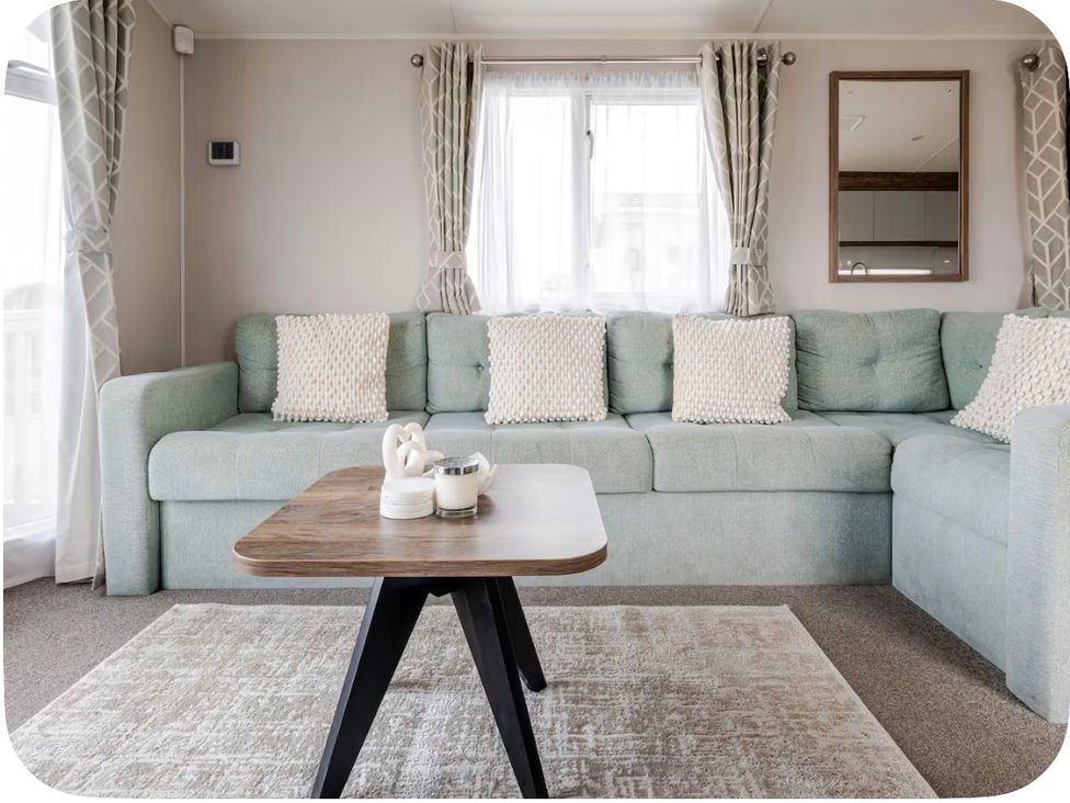 A living room with a sofa and coffee table at Brookwood Willerby, 36 bay view, Filey