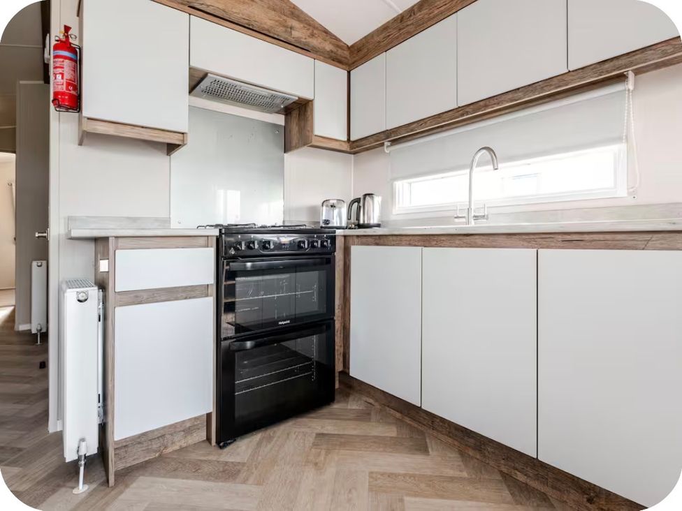 A kitchen with a cooktop and sink at Brookwood Willerby, 36 bay view, Filey