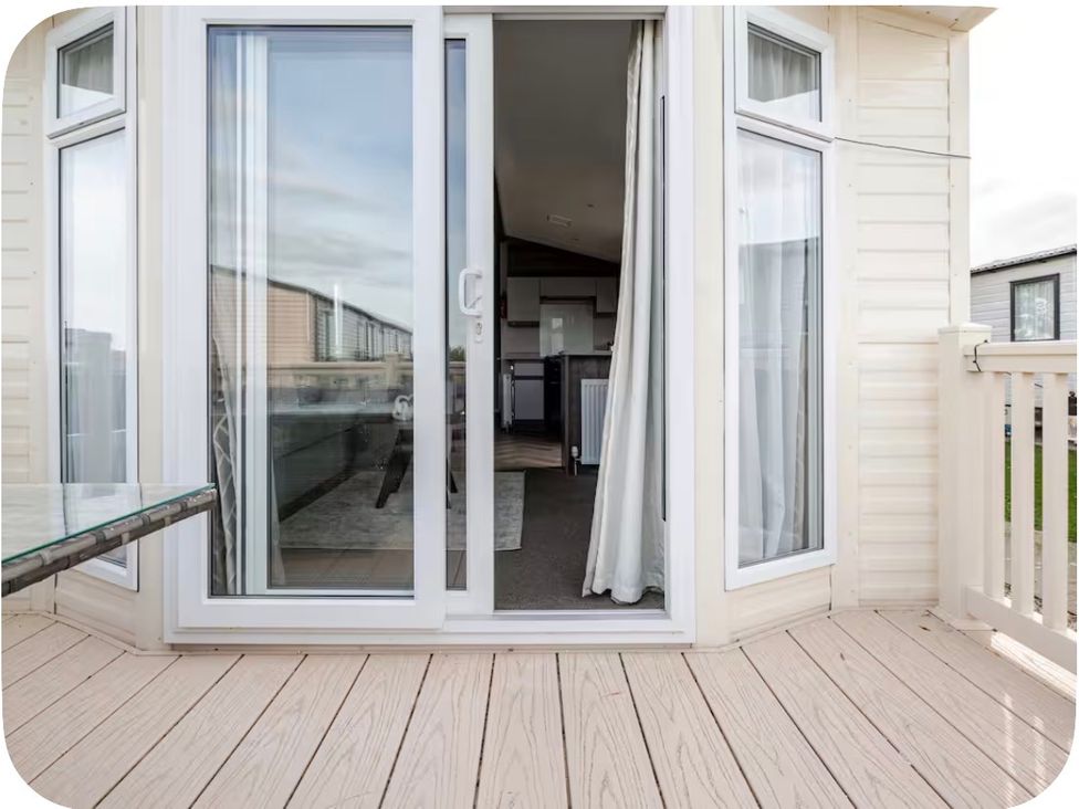 A balcony with a sliding door leading to an interior at Brookwood Willerby, 36 bay view Filey