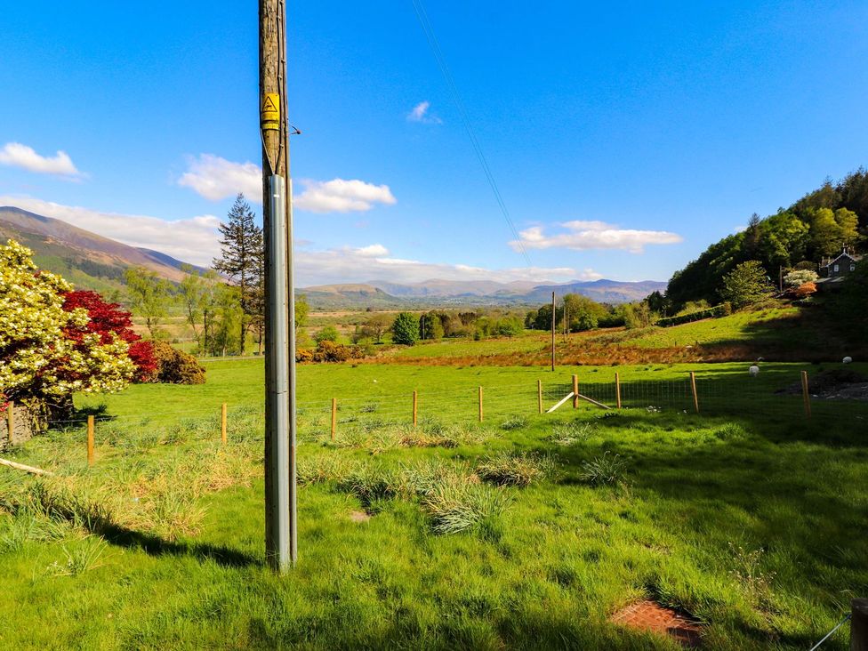 An outdoor view with a power pole and mountains at Swallow's Nest in Keswick