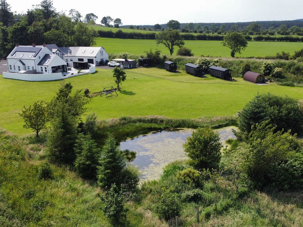 An outdoor view of a house and garden at Jeannies retreat at little lake fb