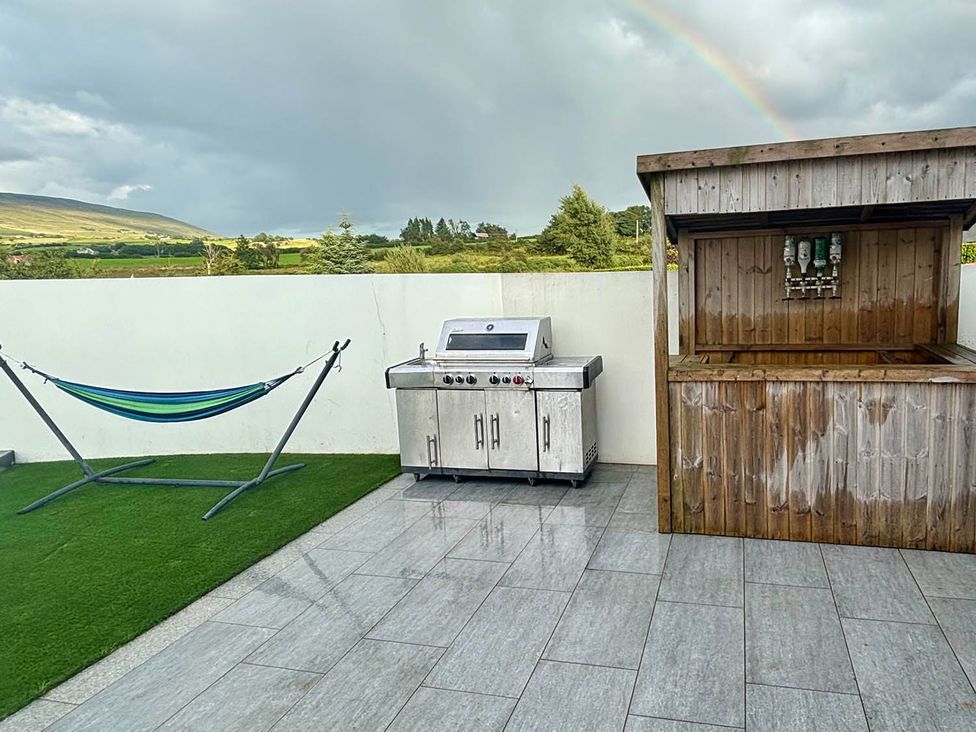An outdoor area with a grill and hammock at Jeannies retreat at little lake fb