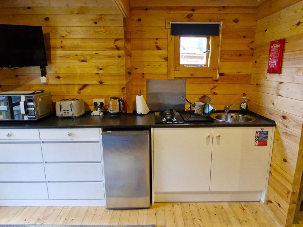 A kitchen with appliances on a counter at Snowdrop Lodge Dog friendly Nr Anderby Creek in Alford