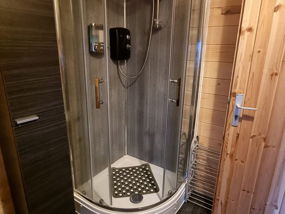 A shower enclosure in a bathroom at 2 bed Lodge near Dunoon on the Shore Front Innellan near Dunoon