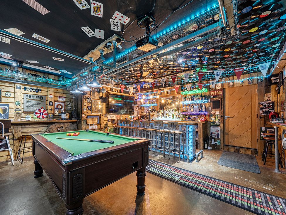 A game room with a pool table and bar at 5 Bed House, Sleeps 14 with Hot Tub and Bar, Tavistock
