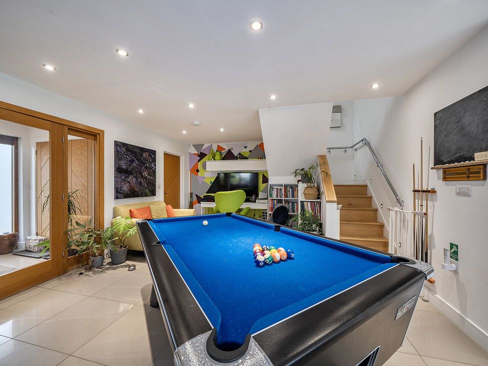 A game room featuring a pool table and stairs at 5 Bed House, Sleeps 14 with Hot Tub and Bar in Tavistock