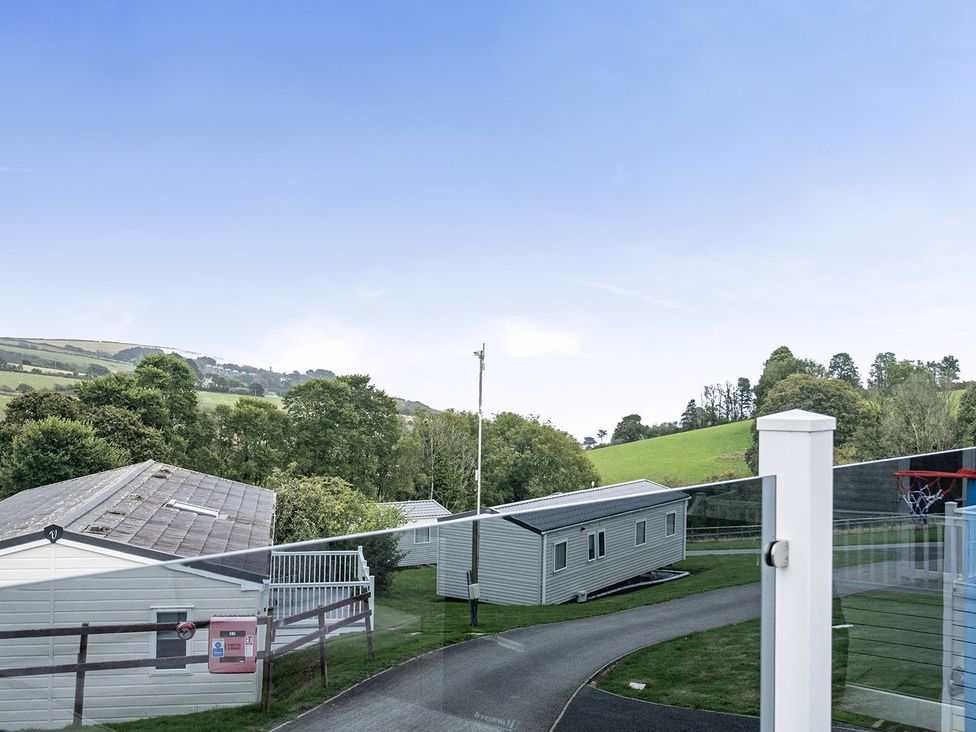 A view of caravans and trees at Ty dee seaview escapes in Looe