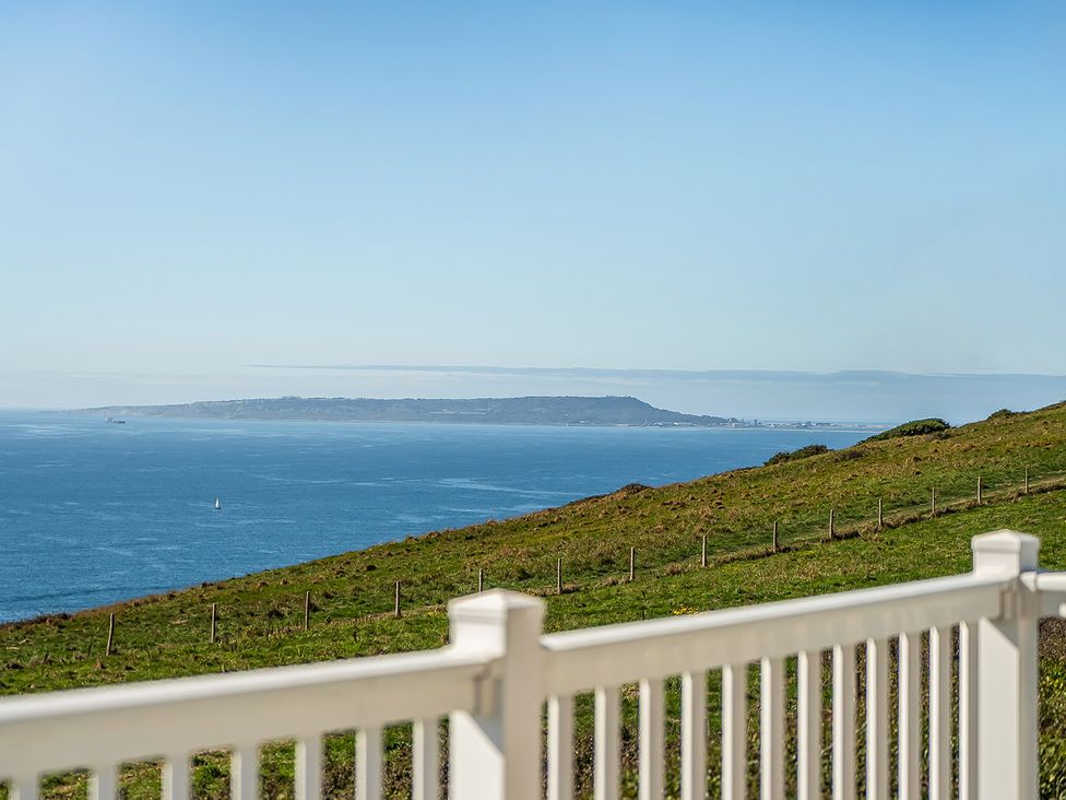 A view of the ocean and hillside at 2 Bed Caravan, Sleeps 4 with Sea Views, West Lulworth