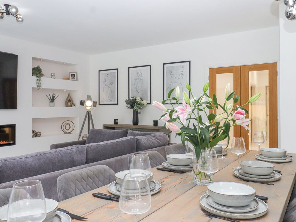A dining room with a table set for dinner at Berisal in Ashford