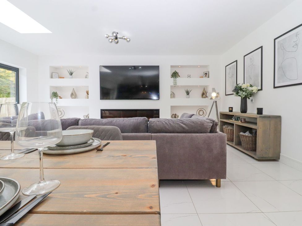 A living room with a sofa and television at Berisal in Ashford