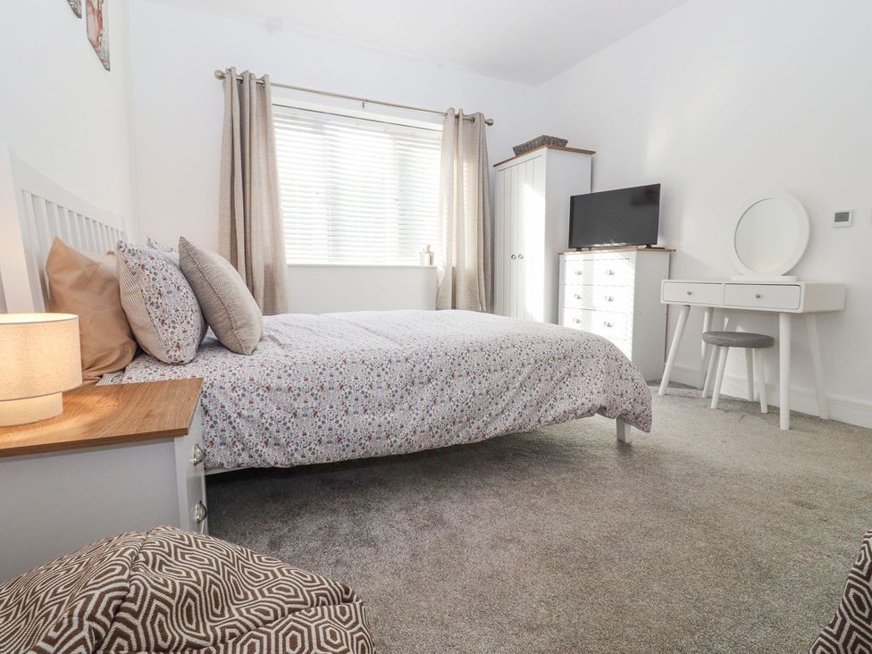 A bedroom with a bed and furniture at Berisal in Ashford