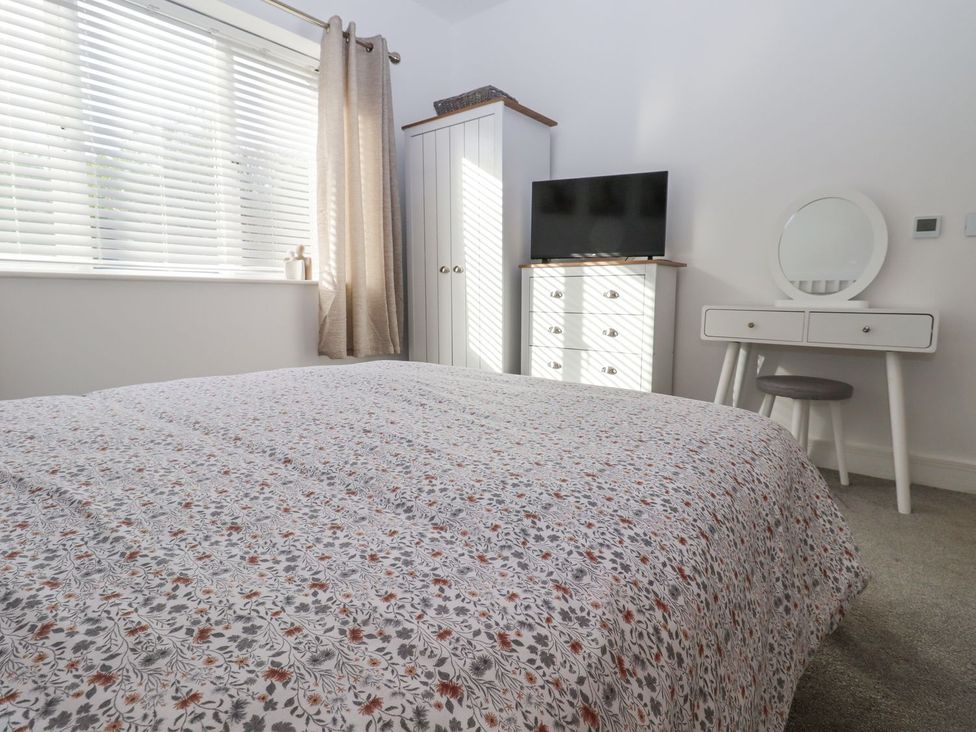 A bedroom with a bed and furniture at Berisal in Ashford