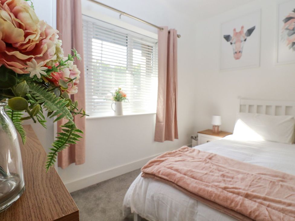 A bedroom with a bed and window at Berisal in Ashford