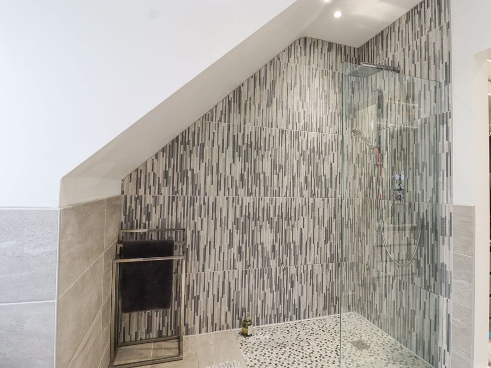 A shower with towel rack in a bathroom at Berisal in Ashford