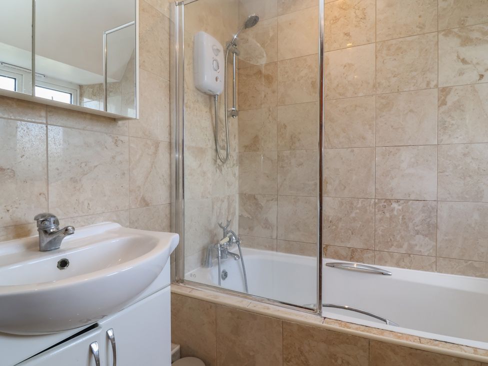 A bathroom with a sink and bathtub at 19 Hailey Road