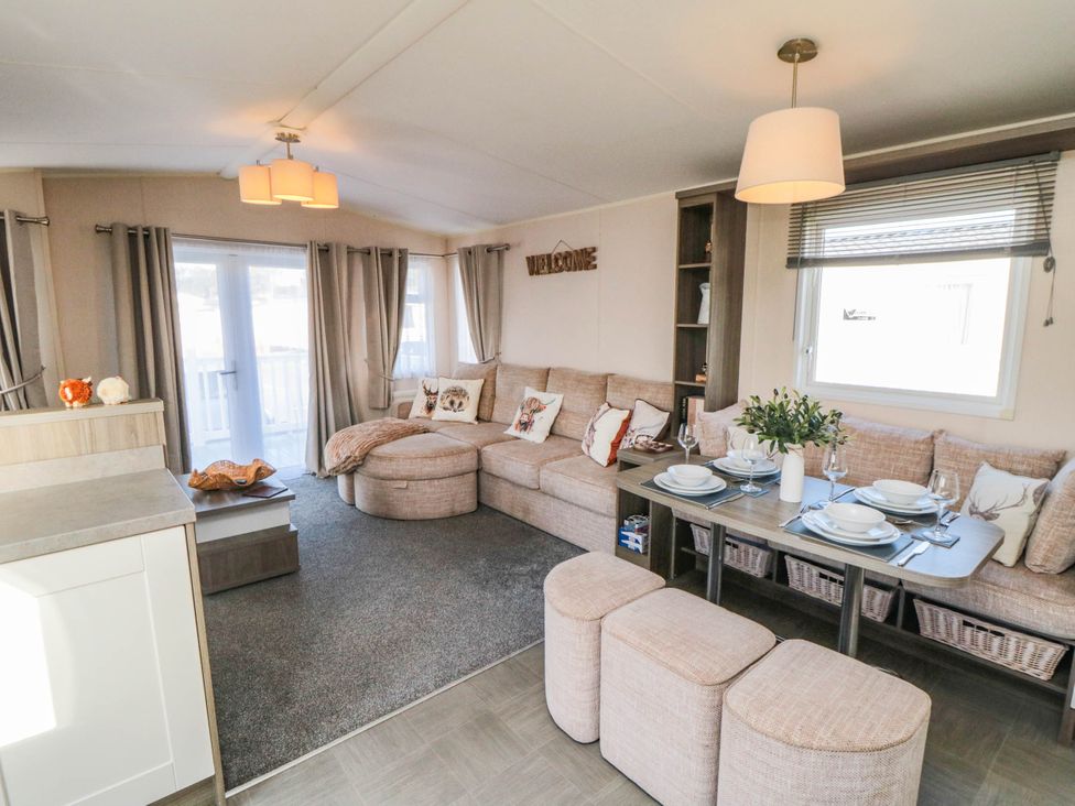 A living room with a sofa and dining table at Gosling 14 in Scarborough