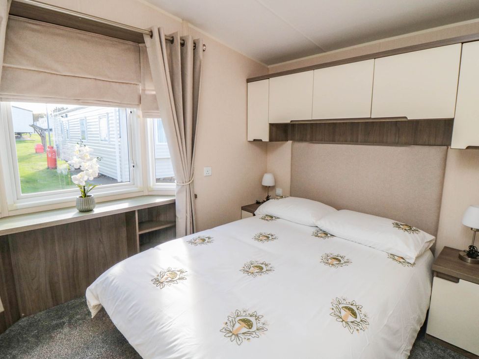 A bedroom with a bed and window at Gosling 14 in Scarborough