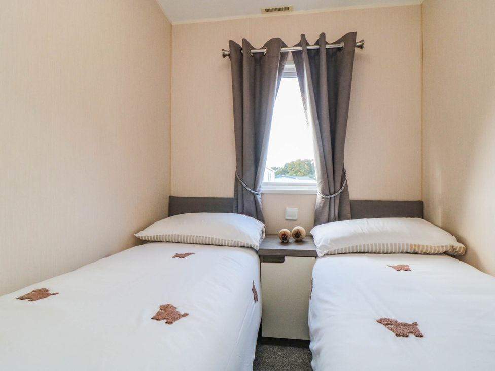 A bedroom with two beds and a window at Gosling 14 in Scarborough