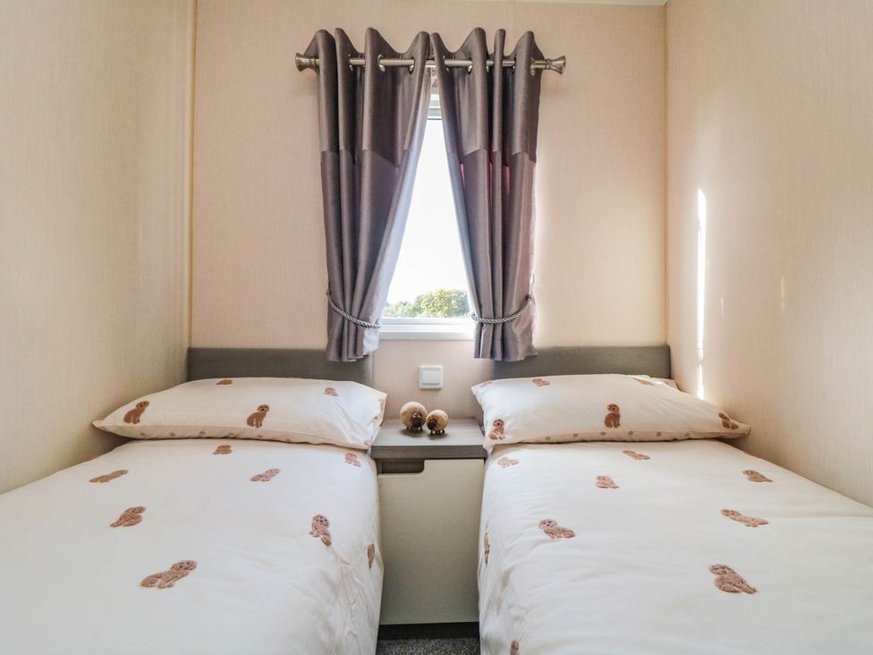 A bedroom with two beds and a window at Gosling 14 in Scarborough