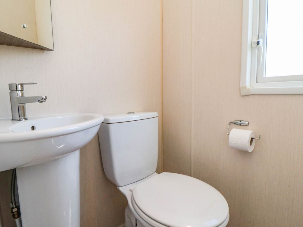 A bathroom with a sink and toilet at Gosling 14 in Scarborough