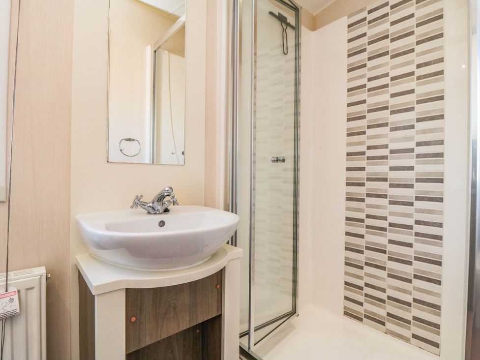 A bathroom with a sink and shower at Gosling 14 in Scarborough