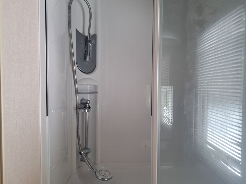 A shower with a shower head and enclosure at Chapel Farm Static Caravan Holiday Park Pennine Views No 17 Appleby-in-Westmorland