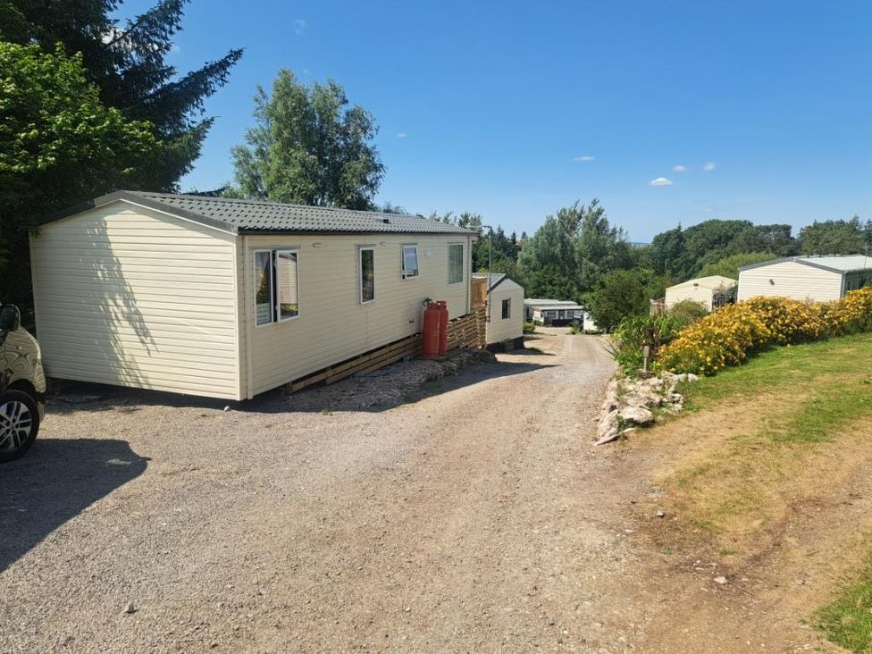 Caravans and greenery at Chapel Farm Static Caravan Holiday Park Pennine Views No 17 Appleby-in-Westmorland