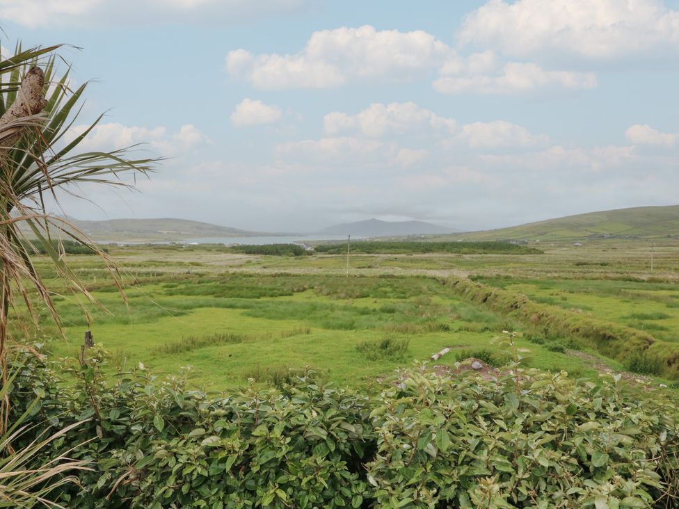 A view of green fields and hills at Wild Atlantic Way Country Cottage in Portmagee, County Kerry