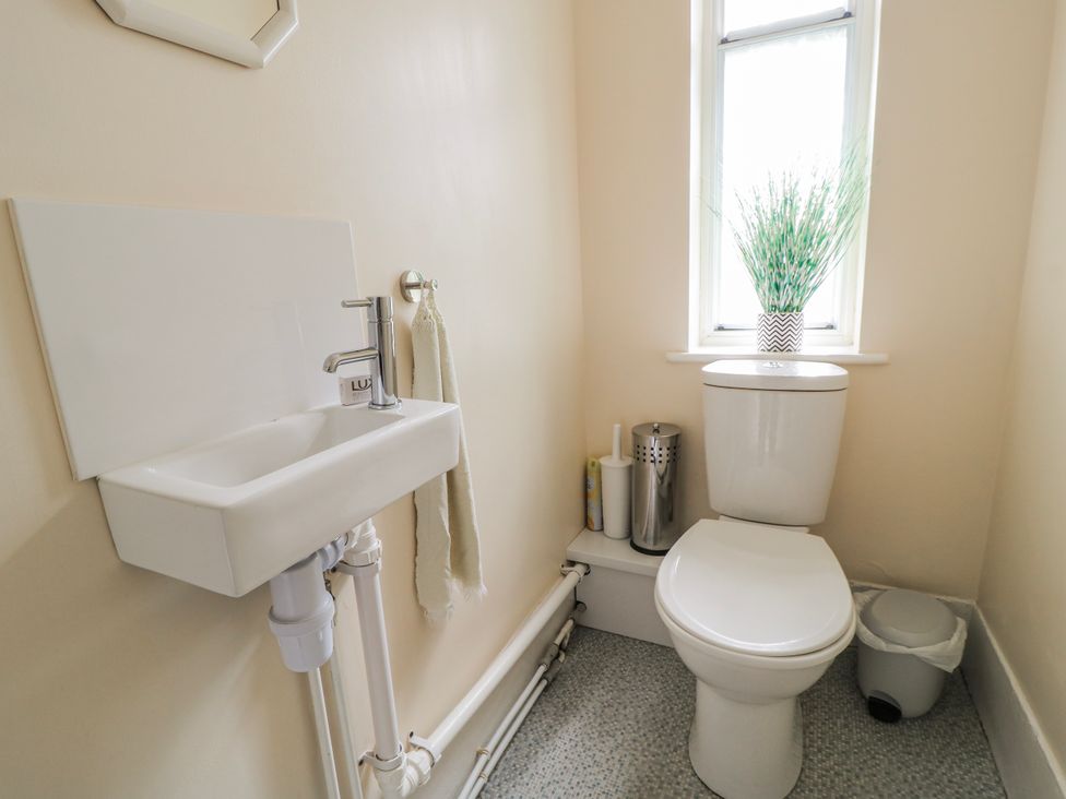 A bathroom with a toilet and sink at Old Higher Lighthouse Stopes Cottage Portland Bill