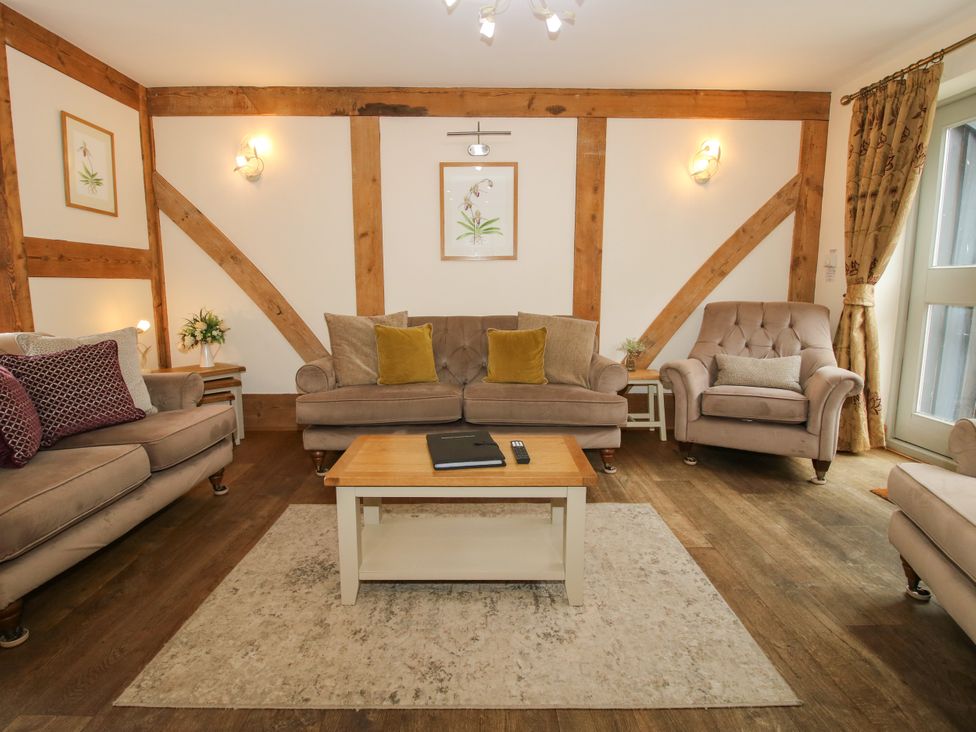 A living room with a coffee table and sofas at The Turnip House in Westhope