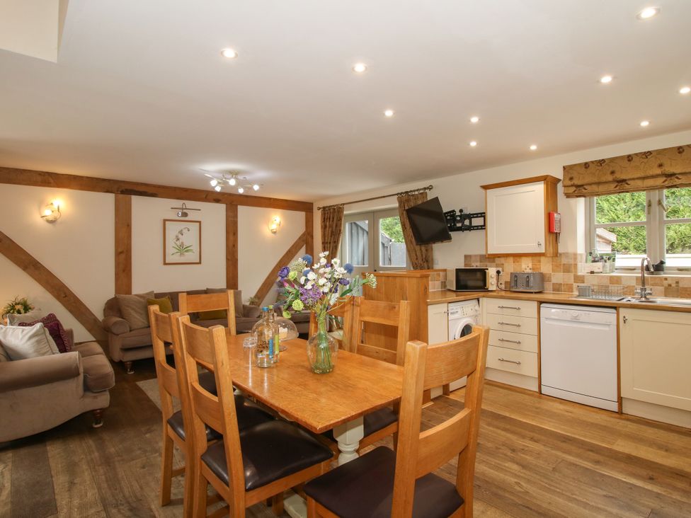 A kitchen with a dining table and chairs at The Turnip House in Westhope