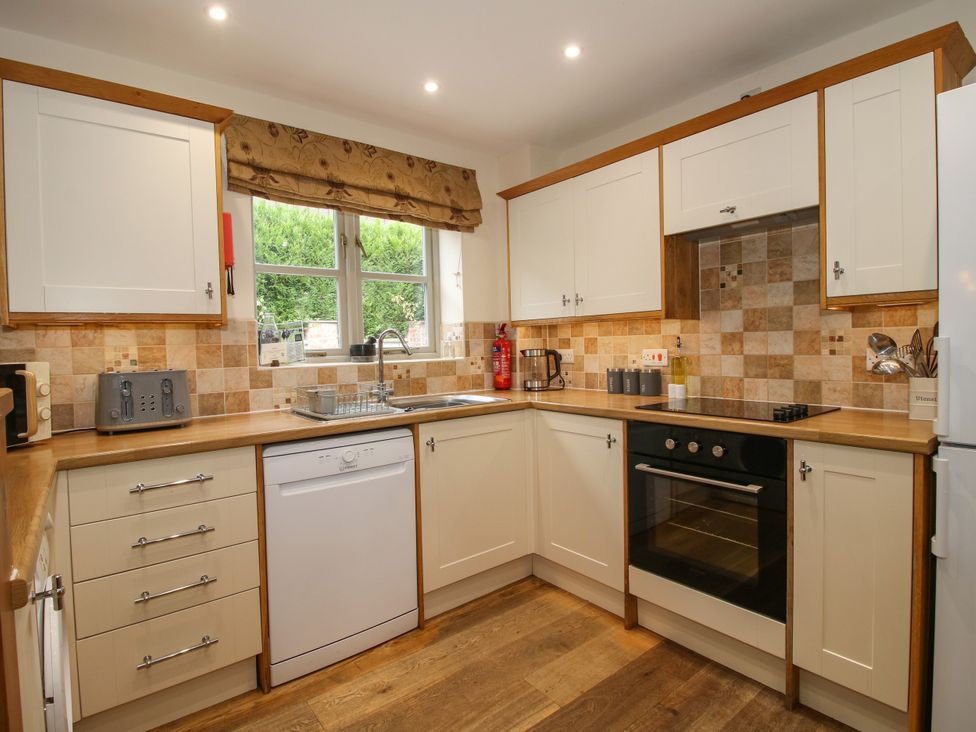 A kitchen with various appliances and cabinets at The Turnip House in Westhope