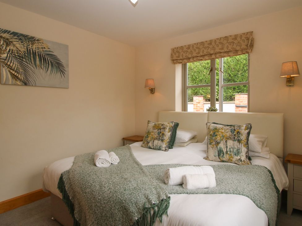 A bedroom with a bed and two pillows at The Turnip House in Westhope