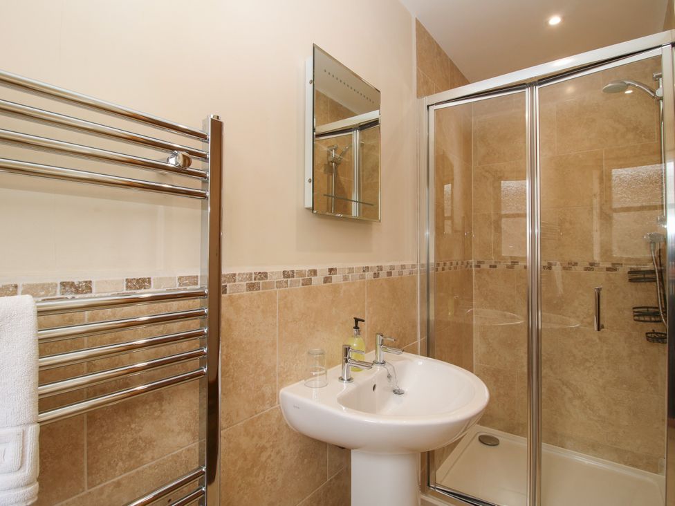 A bathroom with a sink and shower at The Turnip House in Westhope