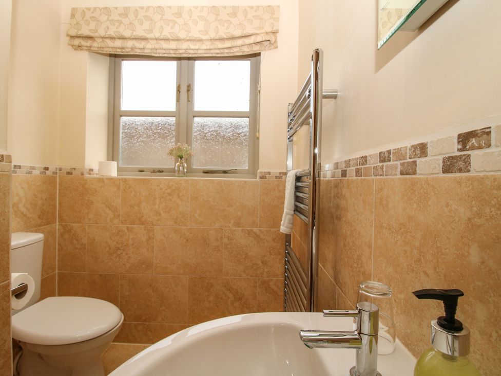 A bathroom with a sink and toilet at The Turnip House in Westhope