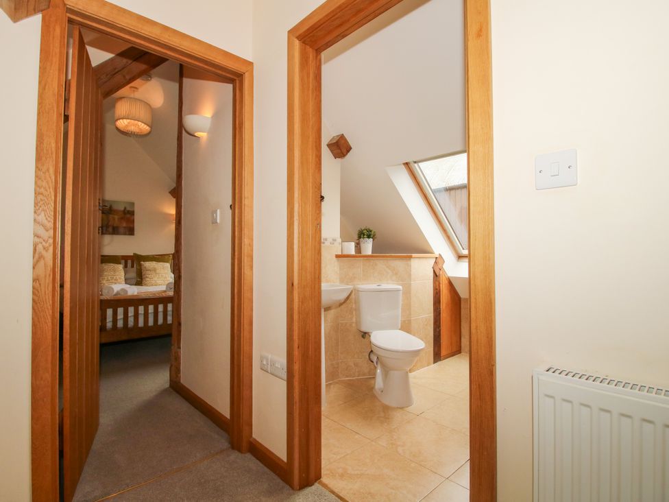 A bathroom with a toilet and sink at The Turnip House in Westhope
