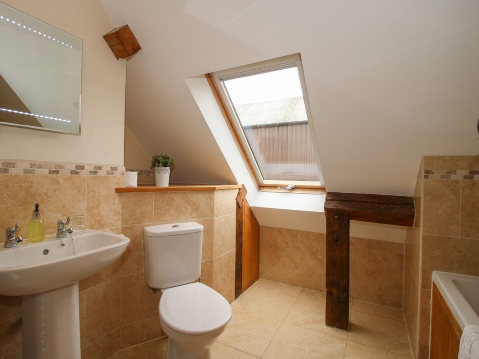 A bathroom with a sink and toilet at The Turnip House in Westhope