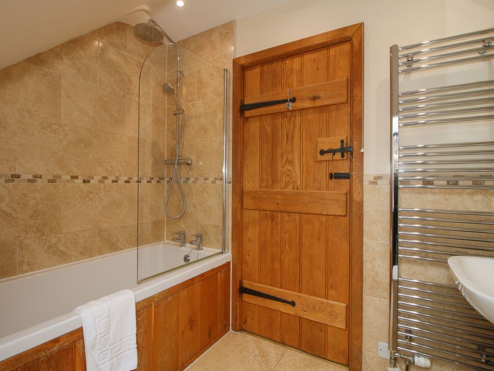 A bathroom with a bath tub and shower at The Turnip House in Westhope