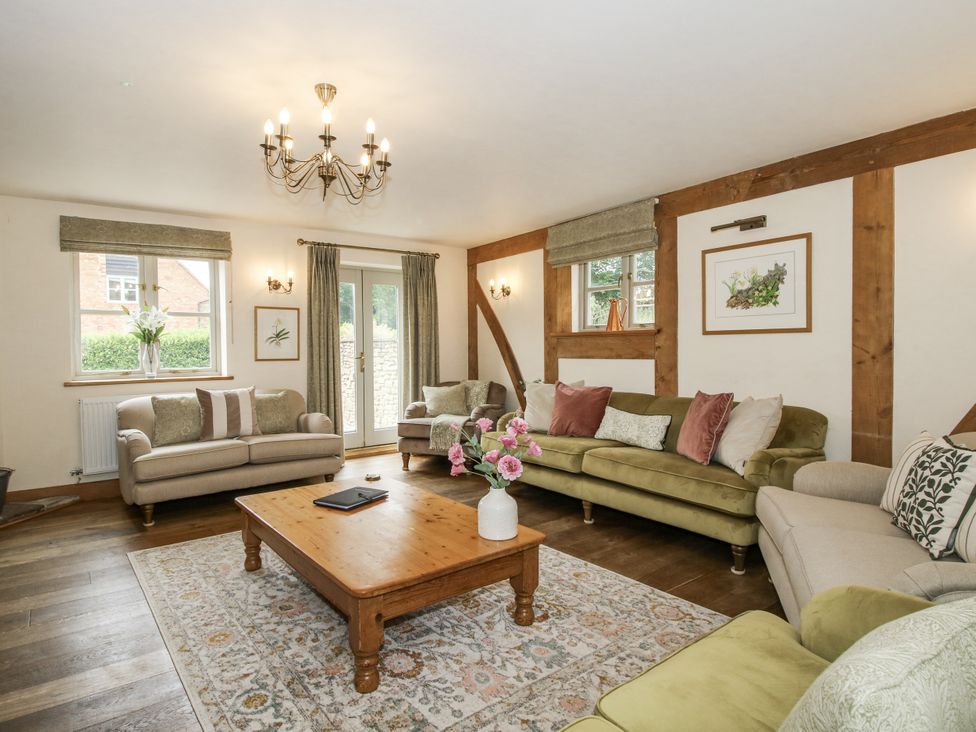 A living room with sofas and a wooden coffee table at The Milking Parlour in Westhope