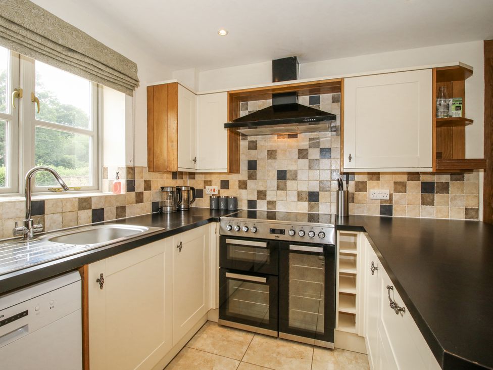 A kitchen with a sink and stove at The Milking Parlour in Westhope