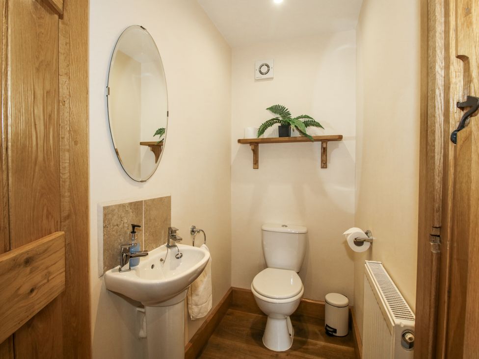 A bathroom with a sink and toilet at The Milking Parlour in Westhope
