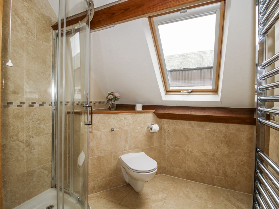 A bathroom with a shower and toilet at The Milking Parlour in Westhope