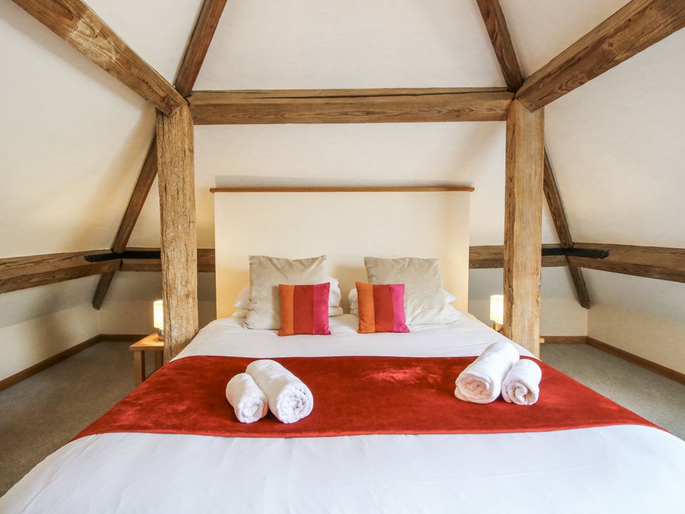 A bedroom with a bed and pillows at The Milking Parlour in Westhope