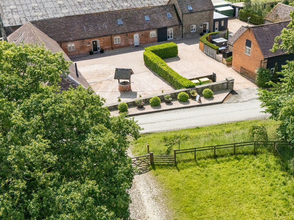 An outdoor area with buildings and a gravel driveway at The Milking Parlour in Westhope