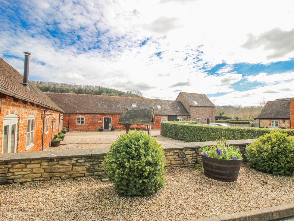 An outdoor view of buildings and landscaping at The Milking Parlour in Westhope